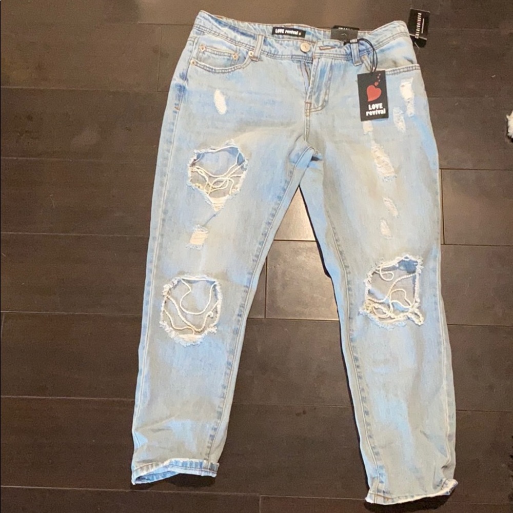 Jeans with rips and pearls